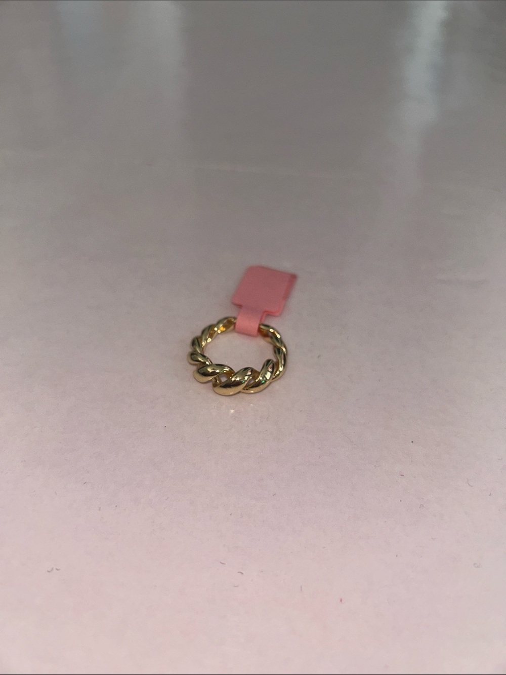 Gold-Tone Braided Ring with Pink Accent Tag